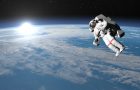 Astronaut or cosmonaut flying upon earth when sun rises, 3d render - Elements of this image furnished by NASA
